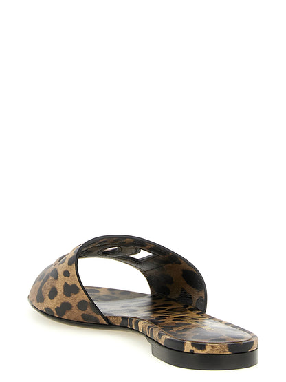 Sliders Sandals Flat Shoes by Dolce & Gabbana for women in calfskin leather brown, leopard-print & print features an statuesque silhouette from the Women's Calfskin Leather Sliders Sandals Flat Shoes collection, showcasing a and a statuesque for a statuesque look.