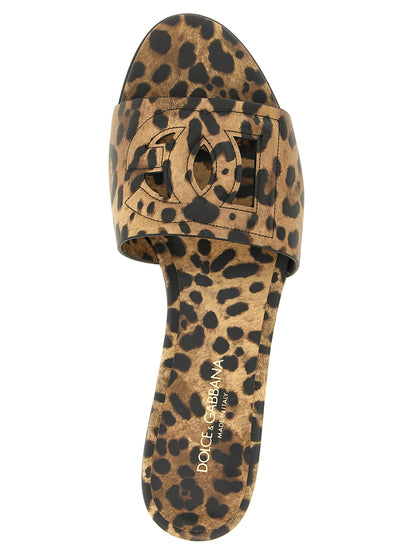Sliders Sandals Flat Shoes by Dolce & Gabbana for women in calfskin leather brown, leopard-print & print features an captivating silhouette, showcasing the captivating style of the Women's Calfskin Leather Sliders Sandals Flat Shoes with its distinct and refined .