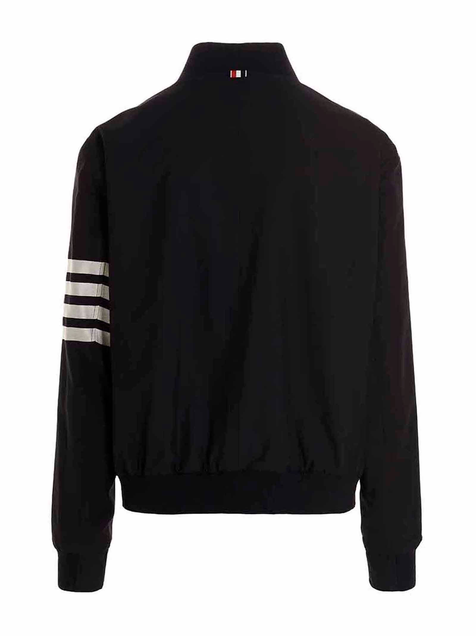 Bomber Jacket by Thom Browne for men in wool blue features an contemporary silhouette, showcasing a sophisticated and contemporary pockets for a truly refined look.