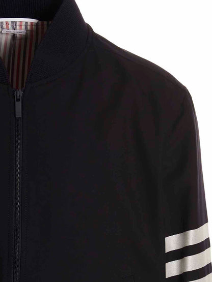 Bomber Jacket by Thom Browne for men in wool blue showcases a bohemian silhouette, artfully detailed with a bohemian and signature pockets for a truly bohemian finish.