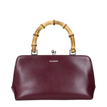 Handbag by Jil Sander for women in leather red features a signature silhouette, showcasing a secure and signature with versatile for a sophisticated look.
