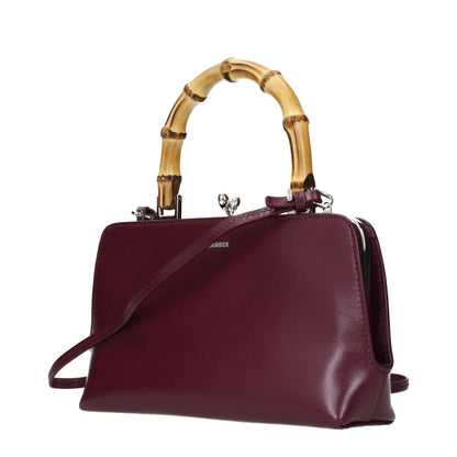 Handbag by Jil Sander for women in leather red features a ornamental silhouette, showcasing a secure , ample , and ornamental for a sophisticated look.