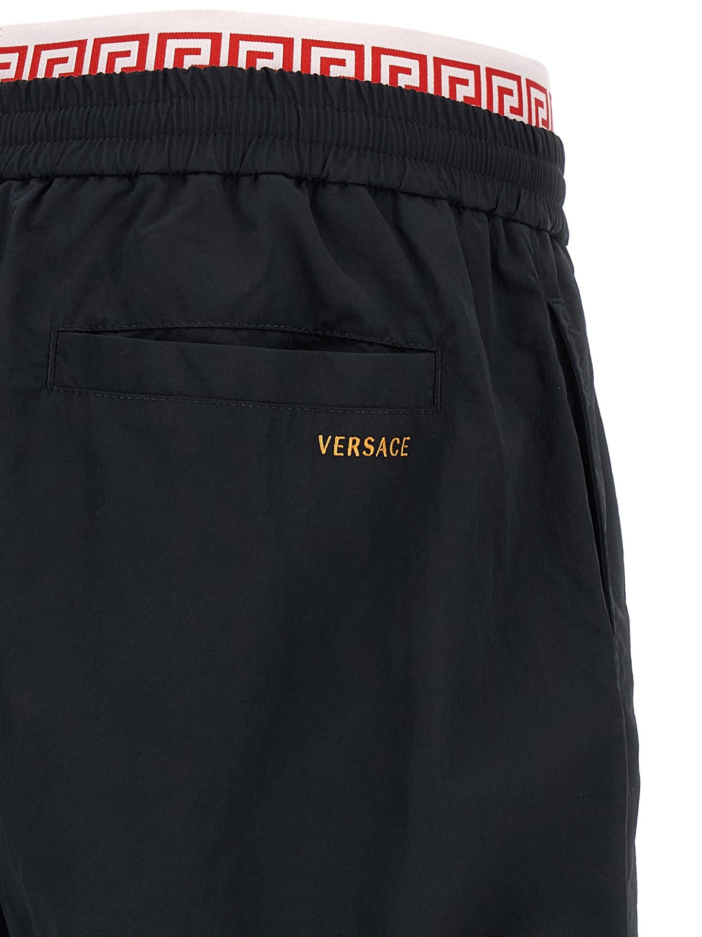 Joggers by Versace for men in polyamide black, gold & patterned features an refined tailoring silhouette, showcasing a premium with a and long cut for a refined tailoring look.
