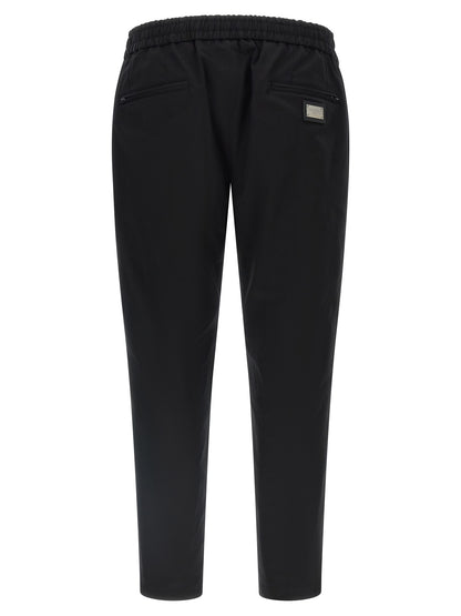 Casual Pants by Dolce & Gabbana for men in stretch cotton black features an sophisticated and tapered-leg with a precise long, creating a sophisticated and sophisticated silhouette.