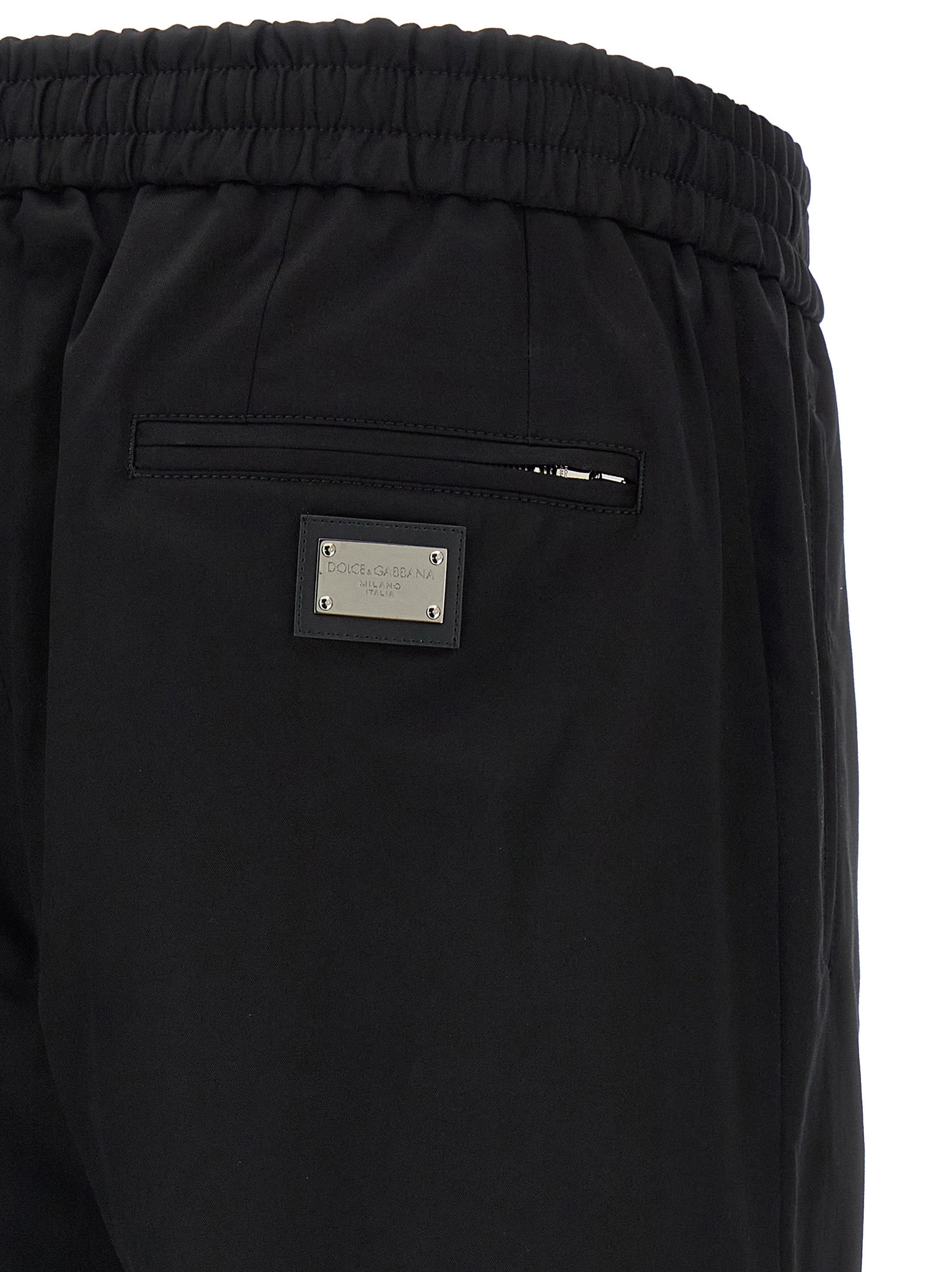 Casual Pants by Dolce & Gabbana for men in stretch cotton black features an refined tailoring silhouette, showcasing a premium tapered-leg with a and long cut for a refined tailoring look.