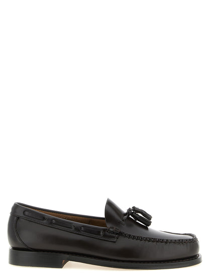 Loafer Slip-On Shoes by G.H. BASS for men in cowhide leather black, brown & gold features an effortless chic silhouette, showcasing the Men's Cowhide Leather Loafer Slip-On Shoes design with an effortless chic and a moc toe style for a effortless chic look.