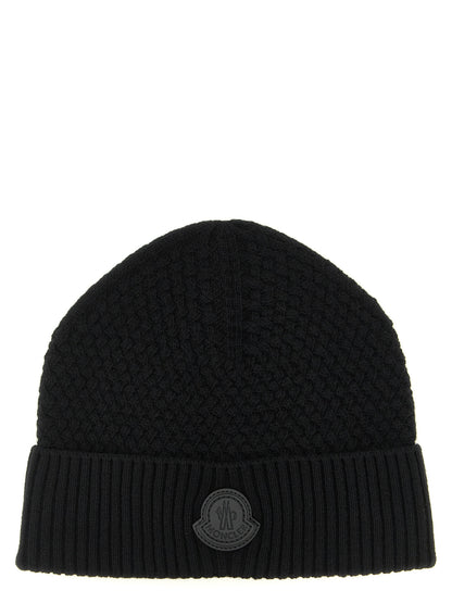 Beanie Hat by Moncler for men in cashmere wool & leather black features a distinguished knit construction, showcasing the sophisticated silhouette and distinguished finish of the Cashmere Wool & Leather Beanie Hat.