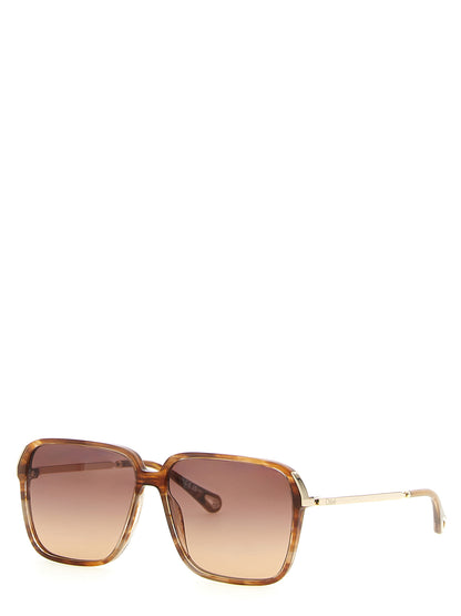 Sunglasses by Chloé for women in lambskin leather and gradient, brown & gold featuring an stylish square frame design with a sophisticated brown coloured frame finish and high-performance gradient lens.
