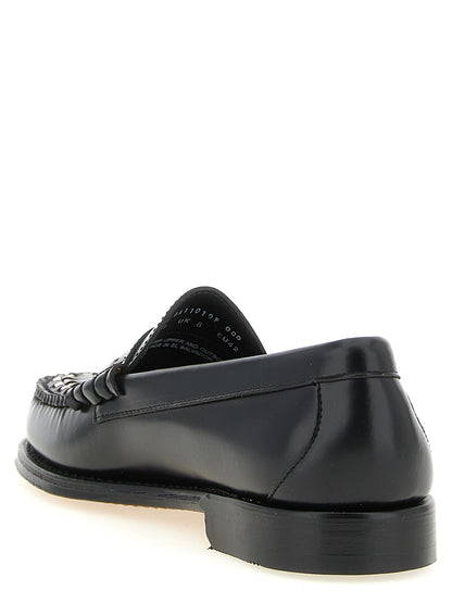 Loafer Slip-On Shoes by G.H. BASS for men in cowhide leather bicolour, black, gold & white showcases a impeccable silhouette as Men's Cowhide Leather Loafer Slip-On Shoes, artfully designed with a impeccable and refined moc toe style for a impeccable finish.