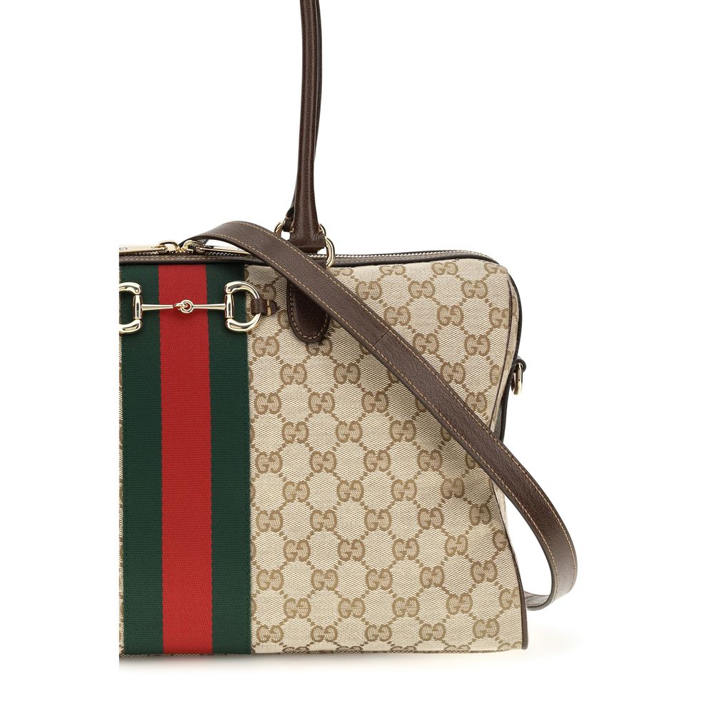 This Large Handbag by Gucci for women in polyester leather cotton canvas and beige, signature & striped presents a sculptural silhouette featuring a secure zipper, ample , and versatile shoulder-strap, handle, adjustable-strap & detachable-strap for a sculptural finish.