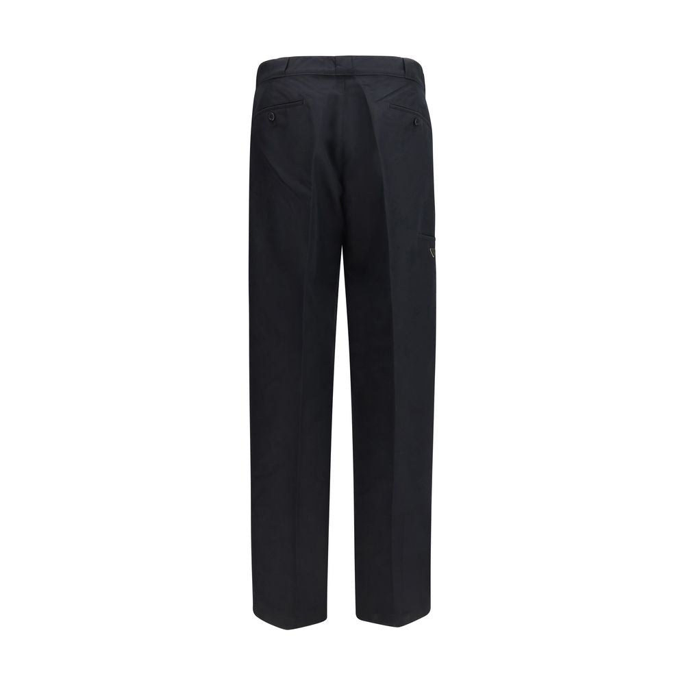 Casual Pants by Prada for men in polyamide cotton canvas black & signature presents a refined pantology silhouette, artfully defined by a refined pantology regular-fit, wide & oversized, long, and a sophisticated .