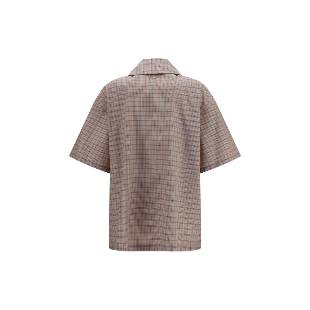 Shirt by Prada for women in cotton multicolor & patterned showcases a sublime silhouette, artfully detailed with a sublime and for a sophisticated, sublime finish.