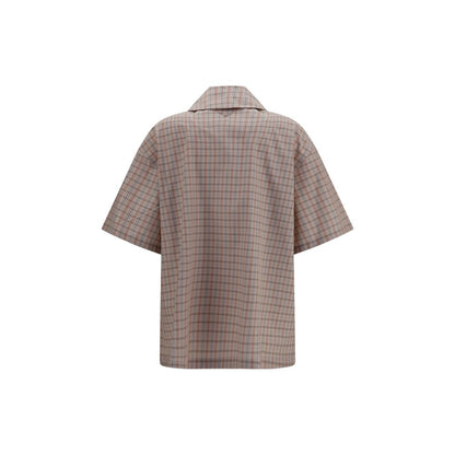 Shirt by Prada for women in cotton multicolor & patterned showcases a sublime silhouette, artfully detailed with a sublime and for a sophisticated, sublime finish.
