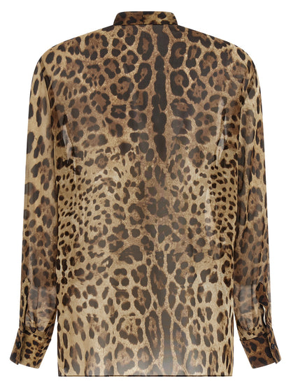 Blouse by Dolce & Gabbana for women in silk animal, brown, transparent & print features an architectural silhouette with a refined and elegant for a architectural look.