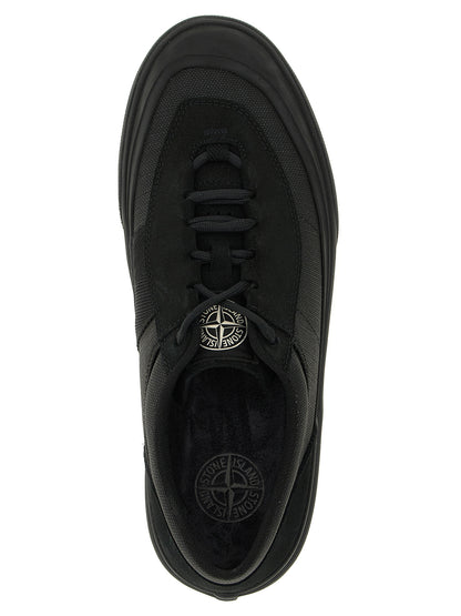 Sneakers by Stone Island for men in linen cotton canvas & suede leather black & signature presents a sumptuous silhouette, artfully capturing the essence of the Men's Low Top Linen Cotton Canvas & Suede Leather Sneakers with its sumptuous low-top style design.