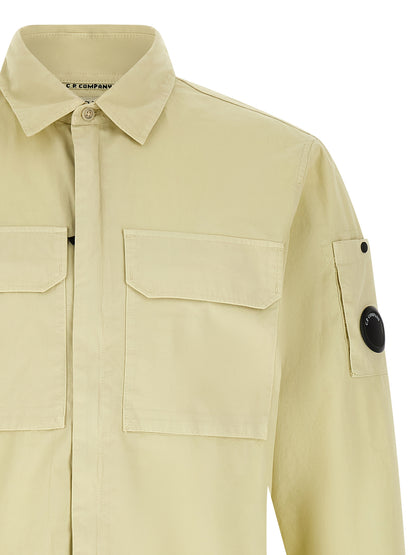 Overshirt by C.P. Company for men in cotton beige & sand showcases a sleek silhouette, elegantly detailed with a sleek and for a sleek finish.