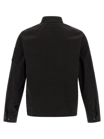 Overshirt by C.P. Company for men in organic cotton black & signature showcases a sharp silhouette, elegantly detailed with a sharp and sharp .