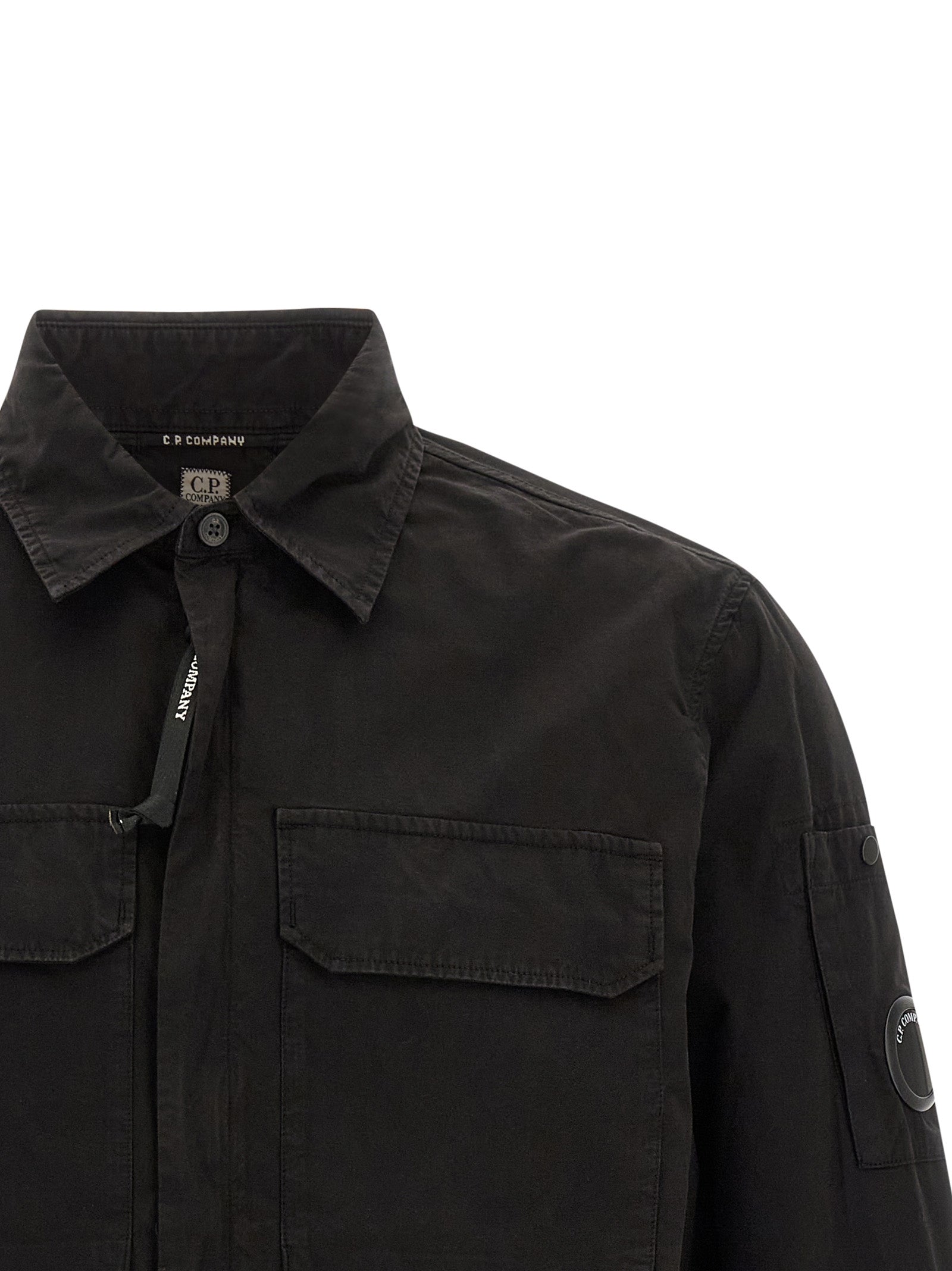 Overshirt by C.P. Company for men in organic cotton black & signature features an architectural silhouette with a refined and elegant for a architectural look.