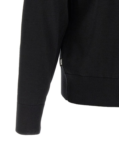 Cardigan by Hugo Boss for men in virgin wool black presents a textural silhouette, artfully finished with a textural and for a sophisticated, textural look.