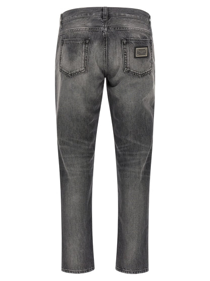 Jeans by Dolce & Gabbana for men in denim cotton gray features an sartorial and long with a cut for a sartorial finish.