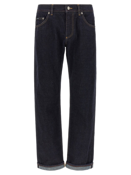 Jeans by Dolce & Gabbana for men in denim cotton blue, indigo & signature features an sartorial and long with a cut for a sartorial finish.