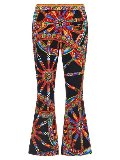 Trousers by Dolce & Gabbana for women in silk multicolor, natural, patterned, floral & print features a tailored silhouette with a tailored flared, defined by its long and a sophisticated .