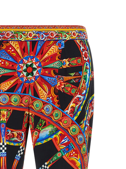 Trousers by Dolce & Gabbana for women in silk multicolor, natural, patterned, floral & print features a artisanal silhouette, showcasing a sophisticated flared with a long and for a artisanal finish.