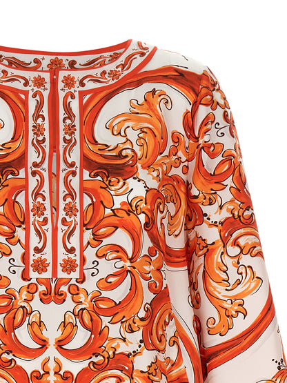 Dress by Dolce & Gabbana for women in silk twill orange, white, patterned & print showcases a striking silhouette, elegantly detailed with a , refined split neckline, and a striking short mini for a striking finish.