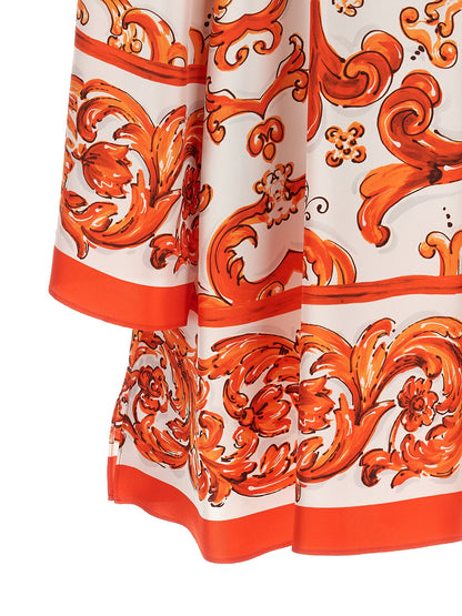 Dress by Dolce & Gabbana for women in silk twill orange, white, patterned & print features an eye catching silhouette with a sophisticated , elegant , and a refined short mini for a eye catching aesthetic.