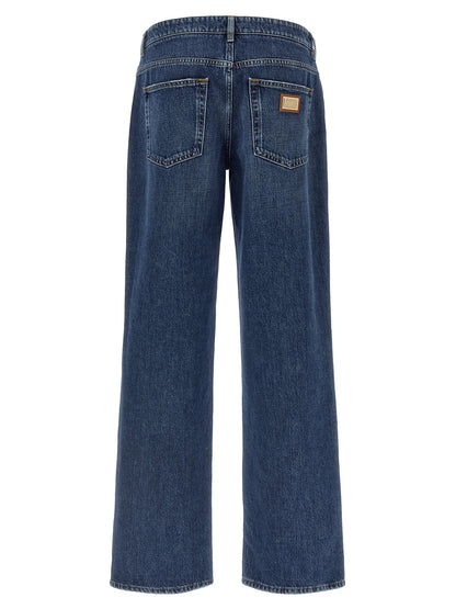 Jeans by Dolce & Gabbana for women in denim cotton blue, gold & signature presents a tailored silhouette, showcasing a tailored straight-leg, relaxed-fit & wide and long cut with a refined for a truly tailored aesthetic.