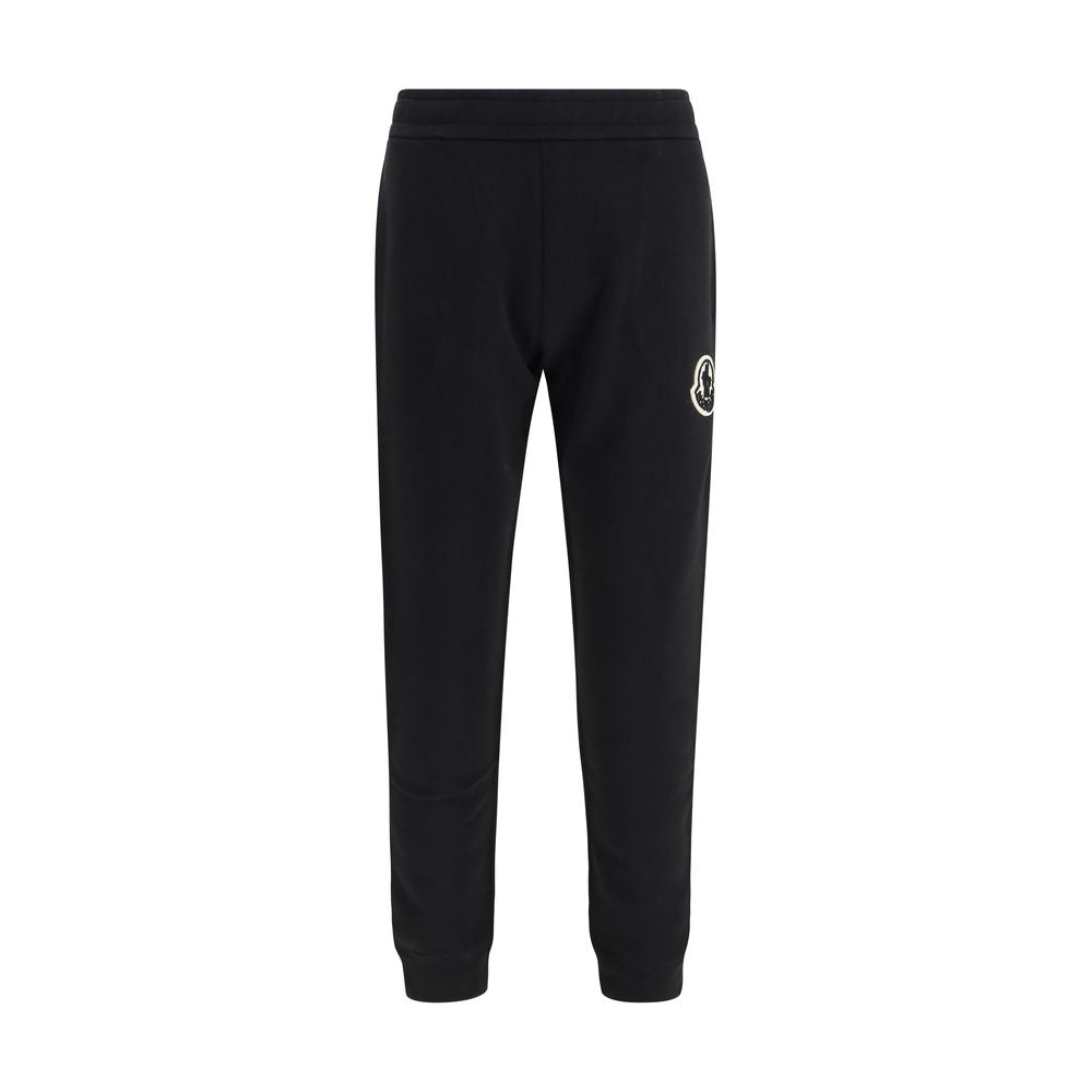Activewear Pants by Moncler for men in cotton black & signature features an sporty tapered-leg, athletic & regular-fit with a long and , expertly finished with for an sporty performance aesthetic.