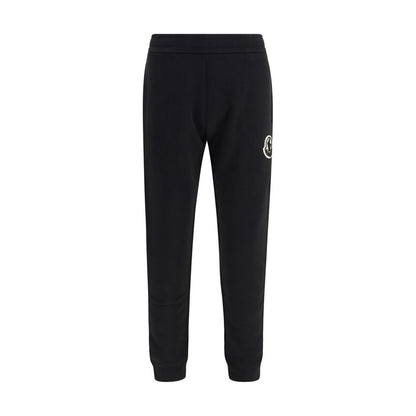 Activewear Pants by Moncler for men in cotton black & signature features an sporty tapered-leg, athletic & regular-fit with a long and , expertly finished with for an sporty performance aesthetic.