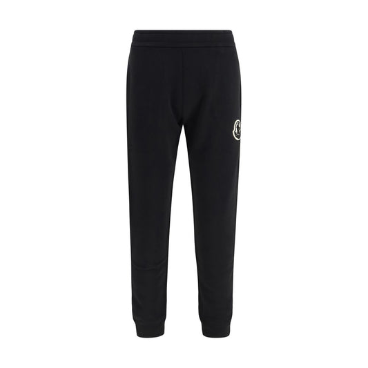 Activewear Pants by Moncler for men in cotton black & signature features an sporty tapered-leg, athletic & regular-fit with a long and , expertly finished with for an sporty performance aesthetic.