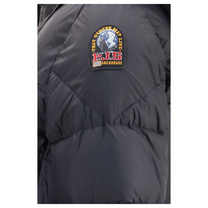 Hooded Puffer Jacket by Parajumpers for women in nylon duck & goose down black showcases a bohemian silhouette, artfully detailed with a bohemian hooded neckline and signature pockets, hooded & insulated for a truly bohemian finish.