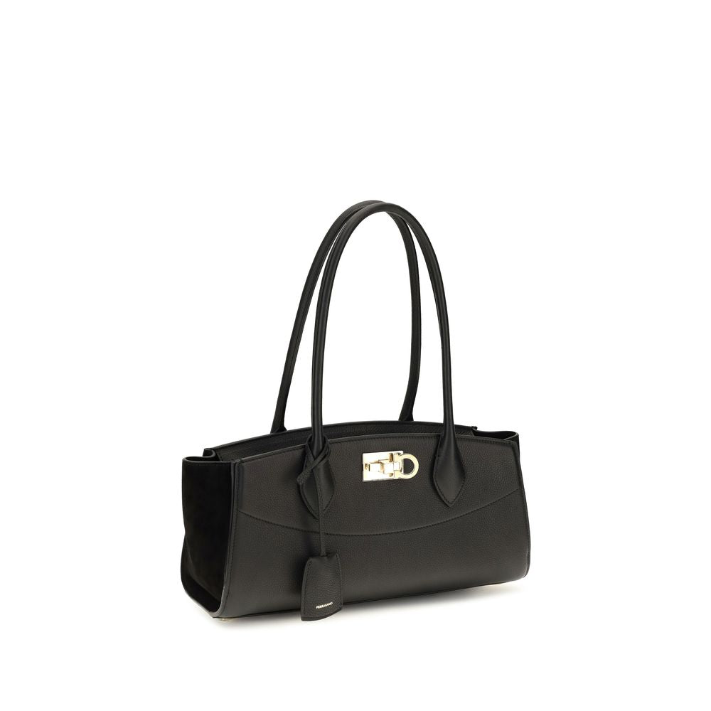 East West Shoulder Bag by Ferragamo for women in bos taurus suede calf leather black & signature features a distinguished silhouette, showcasing a secure buckle and distinguished external-pockets with versatile shoulder-strap & handle for a distinguished finish.