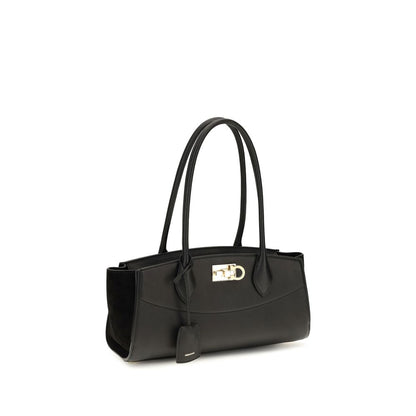 East West Shoulder Bag by Ferragamo for women in bos taurus suede calf leather black & signature features a distinguished silhouette, showcasing a secure buckle and distinguished external-pockets with versatile shoulder-strap & handle for a distinguished finish.
