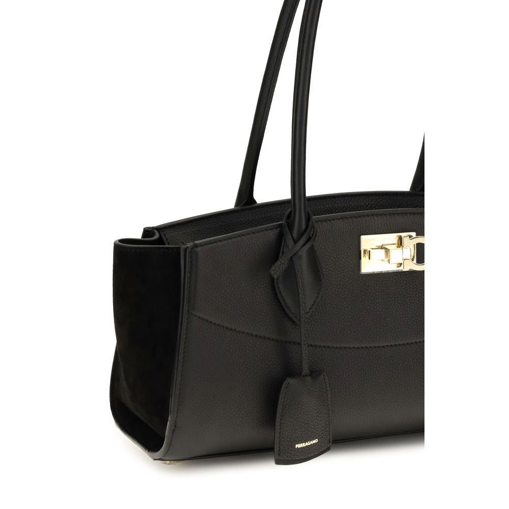 East West Shoulder Bag by Ferragamo for women in bos taurus suede calf leather black & signature presents a versatile silhouette, showcasing a secure buckle and versatile external-pockets with versatile shoulder-strap & handle for a sophisticated look.