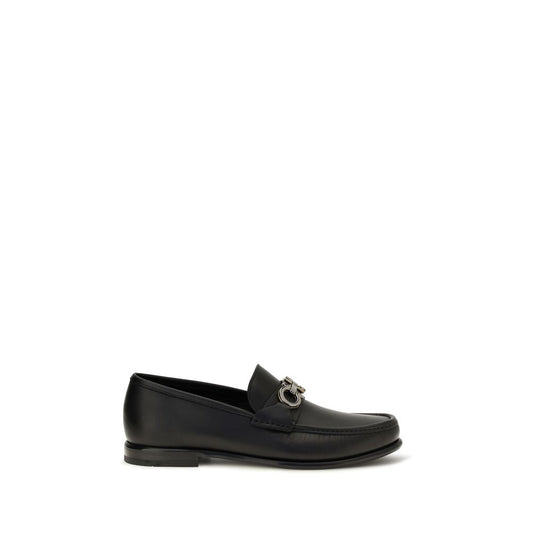 This Loafer Slip-On Shoes by Ferragamo for men in bos taurus calf leather black & signature features an exquisite silhouette from the Gancini Men's Bos Taurus Calf Leather Loafer Slip-On Shoes collection, defined by a sophisticated and elegant .