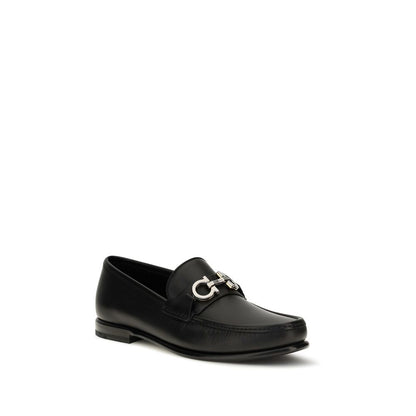 Loafer Slip-On Shoes by Ferragamo for men in bos taurus calf leather black & signature features an dynamic silhouette from the Gancini Men's Bos Taurus Calf Leather Loafer Slip-On Shoes collection, defined by a dynamic and for a dynamic look.