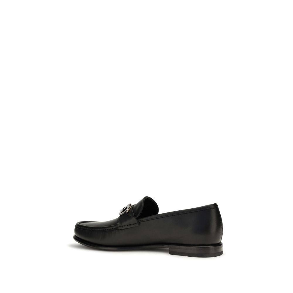 Loafer Slip-On Shoes by Ferragamo for men in bos taurus calf leather black & signature showcases a timeless silhouette from the Gancini Men's Bos Taurus Calf Leather Loafer Slip-On Shoes collection, featuring a timeless and for a timeless finish.