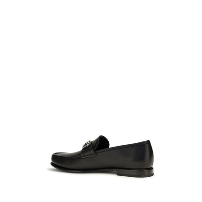 Loafer Slip-On Shoes by Ferragamo for men in bos taurus calf leather black & signature showcases a timeless silhouette from the Gancini Men's Bos Taurus Calf Leather Loafer Slip-On Shoes collection, featuring a timeless and for a timeless finish.
