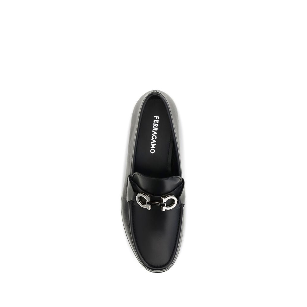 Loafer Slip-On Shoes by Ferragamo for men in bos taurus calf leather black & signature features an effortless chic silhouette, showcasing the Gancini Men's Bos Taurus Calf Leather Loafer Slip-On Shoes design with an effortless chic and a for a effortless chic look.