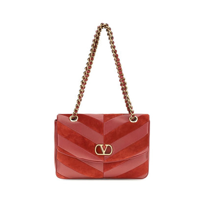 2-in-1 Shoulder & Crossbody Bag by Valentino Garavani for women in bos taurus calf nappa & suede leather multicolor, chevron & patchwork showcases a enviable silhouette, artfully detailed with a secure zipper & magnetic, organized , and versatile crossbody-strap & shoulder-strap for a enviable look.