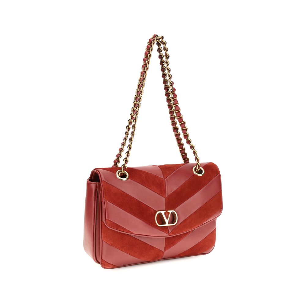 2-in-1 Shoulder & Crossbody Bag by Valentino Garavani for women in bos taurus calf nappa & suede leather multicolor, chevron & patchwork features a effortless chic silhouette with a secure zipper & magnetic, ample , and versatile crossbody-strap & shoulder-strap for a effortless chic finish.