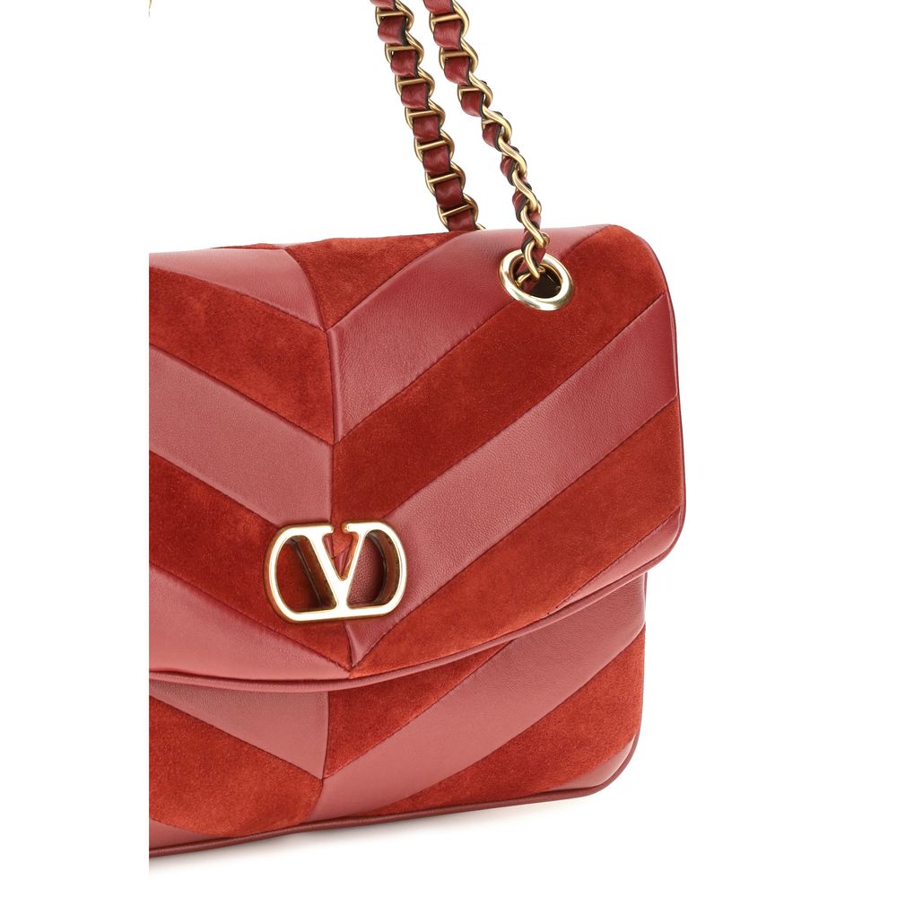 2-in-1 Shoulder & Crossbody Bag by Valentino Garavani for women in bos taurus calf nappa & suede leather multicolor, chevron & patchwork features a distinguished silhouette, showcasing a secure zipper & magnetic and distinguished with versatile crossbody-strap & shoulder-strap for a distinguished finish.
