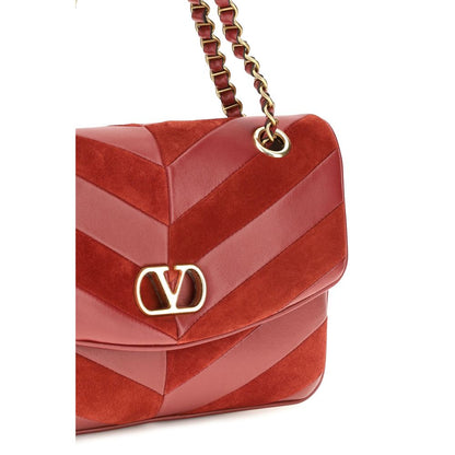 2-in-1 Shoulder & Crossbody Bag by Valentino Garavani for women in bos taurus calf nappa & suede leather multicolor, chevron & patchwork features a distinguished silhouette, showcasing a secure zipper & magnetic and distinguished with versatile crossbody-strap & shoulder-strap for a distinguished finish.