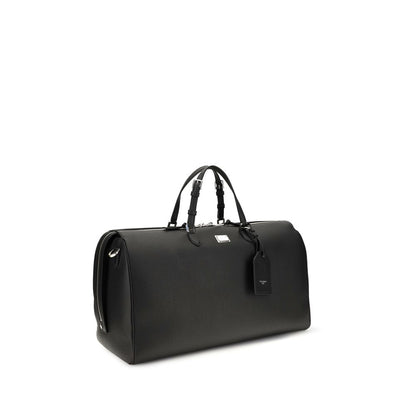 Briefcase by Dolce & Gabbana for men in pvc bos taurus calfskin nappa leather & palladium black, natural & palladium presents a contemporary silhouette from the Vittoria PVC Bos Taurus Calfskin Nappa Leather & Palladium Briefcase collection, featuring a contemporary zipper, ample internal-pockets, and versatile shoulder-strap, handle & adjustable-strap.