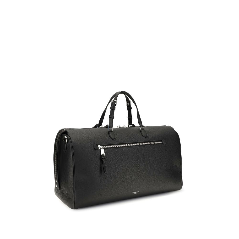 Briefcase by Dolce & Gabbana for men in pvc bos taurus calfskin nappa leather & palladium black, natural & palladium presents a distinguished silhouette, perfectly capturing the Vittoria PVC Bos Taurus Calfskin Nappa Leather & Palladium Briefcase aesthetic with a secure zipper, ample internal-pockets, and versatile shoulder-strap, handle & adjustable-strap.