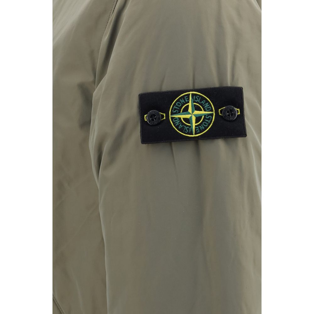 Hooded Windbreaker Jacket by Stone Island for men in polyamide polyester twill bicolour & signature showcases a urban chic silhouette, detailed with a urban chic and functional pockets, hooded, insulated & windproof for a polished finish.