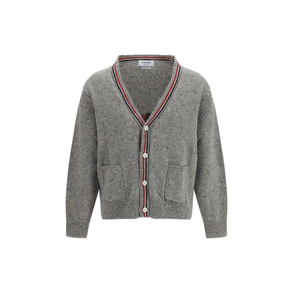 Cardigan by Thom Browne for men in merino wool & mohair gray, signature, patchwork & striped features an impeccable silhouette, showcasing a sophisticated v-neck neckline and detail for a truly impeccable finish.